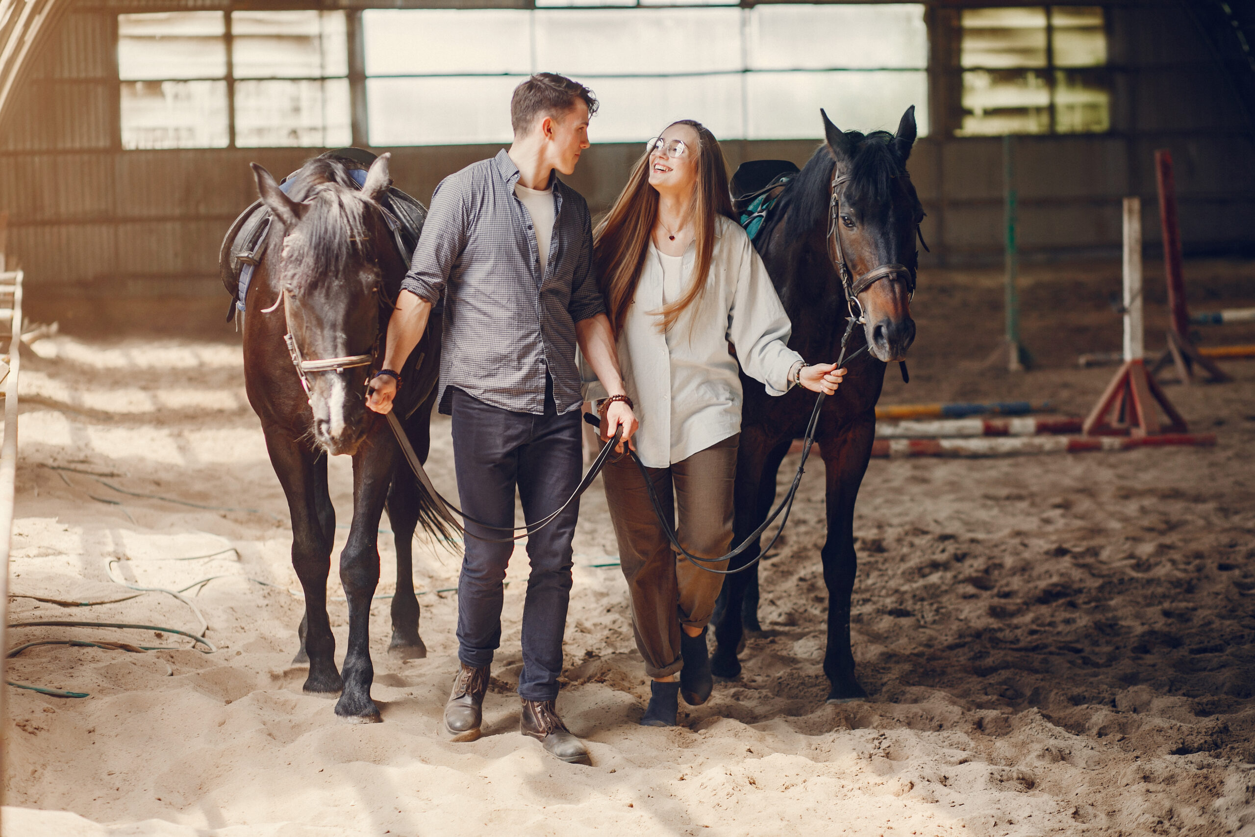 cute loving couple with horse on ranch